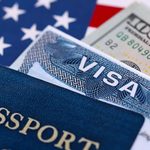 passport-visa-and-us-currency-on-flag-2026-03-09-02-53-23-utc