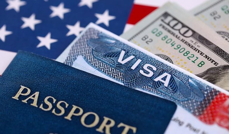 passport-visa-and-us-currency-on-flag-2026-03-09-02-53-23-utc